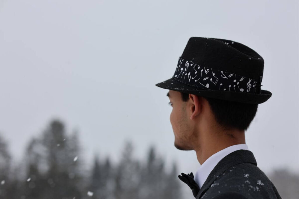 man looking off in the snow